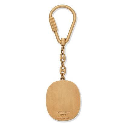 Patek Philippe. A yellow gold oval keychain, Ellipse, Ref 9602